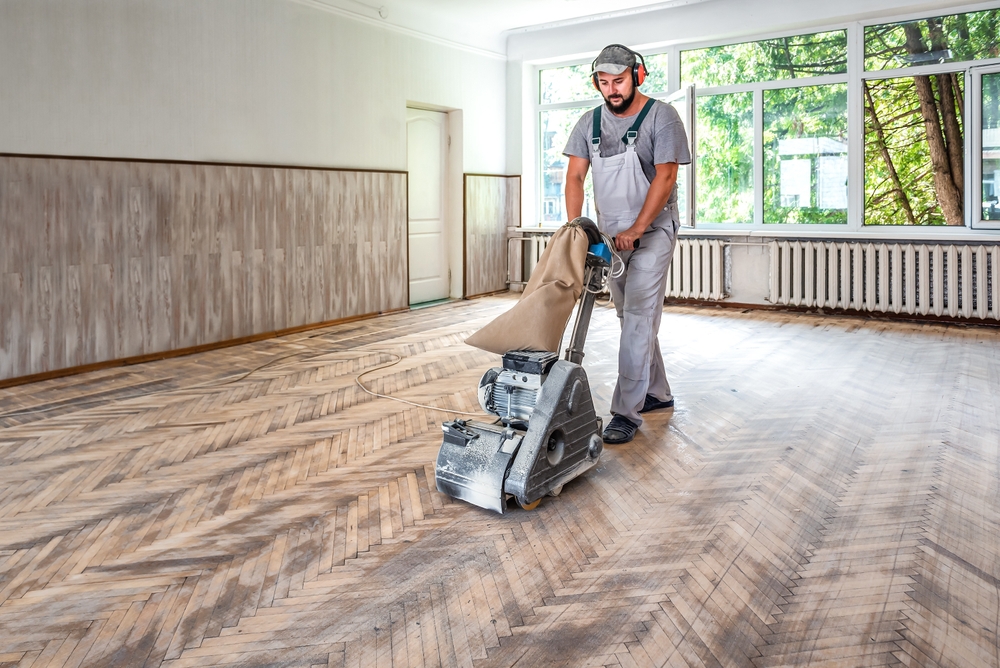 sanding hardwood floor man