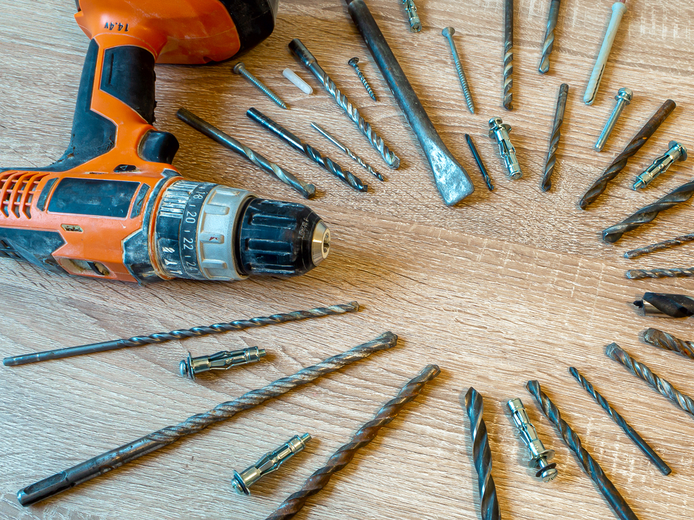 drill and drill bits on table